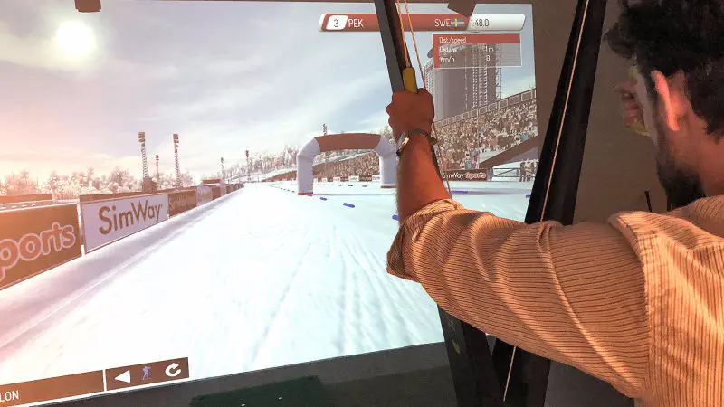 Biathlete skiing and shooting in the SimWay Biathlon simulator